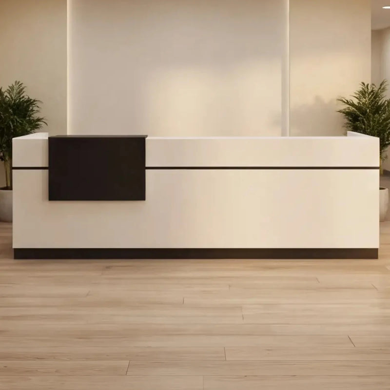 Levi front desk, left configuration, flanked by plants