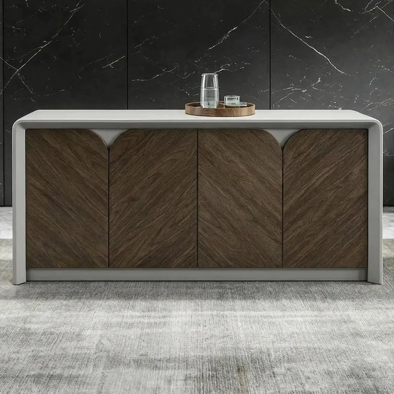 Clermont 5′3″ (63-inch) office credenza front view, walnut chevron doors in a white curved shell, black marble wall behind