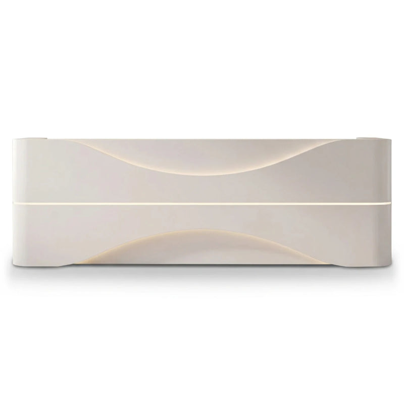 Nerielle reception desk with carved wave front and lit reveal, studio view