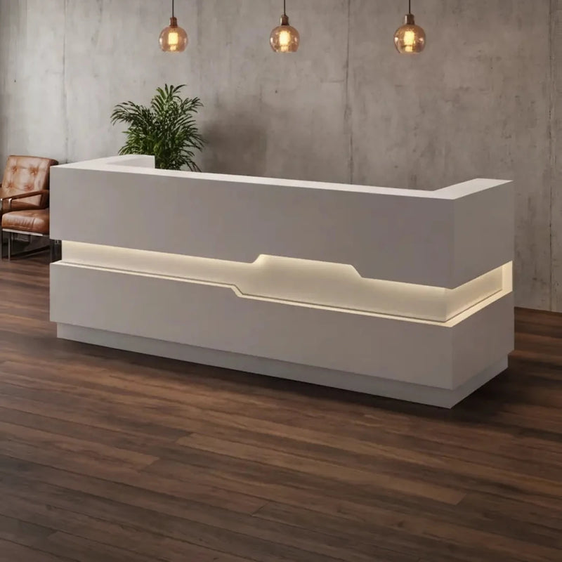Eris front desk under industrial pendants in a loft lobby