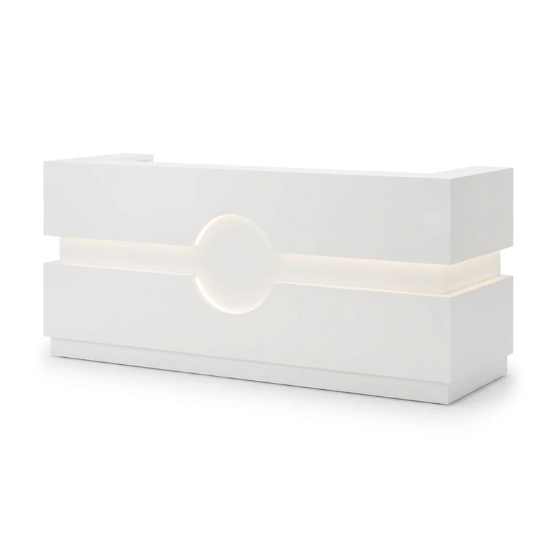 Liora reception desk with lit band and circle medallion, studio angle