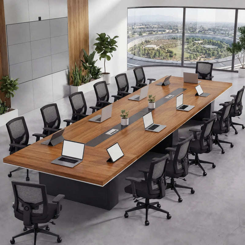Accord large conference table in walnut seating 12 with laptops, in a bright office with plants