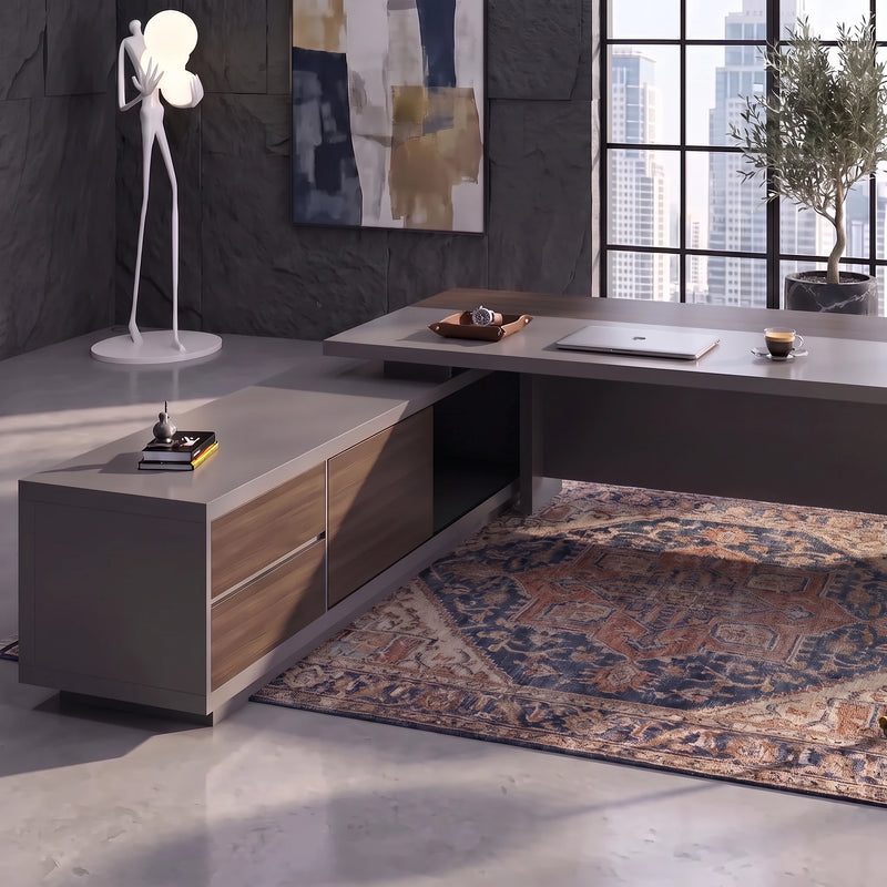 Carwin executive desk in a slate-blue office with sculptural floor lamp