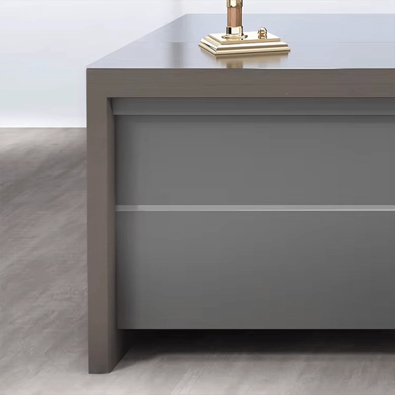 Exeter desk close-up: the pedestal front pairs two tones of gray