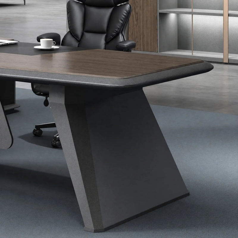 Faceted charcoal blade leg of the Alwin desk on carpet
