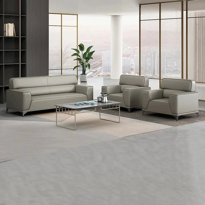 Ingarö gray sitting area set around a glass coffee table in a bright lobby with city views