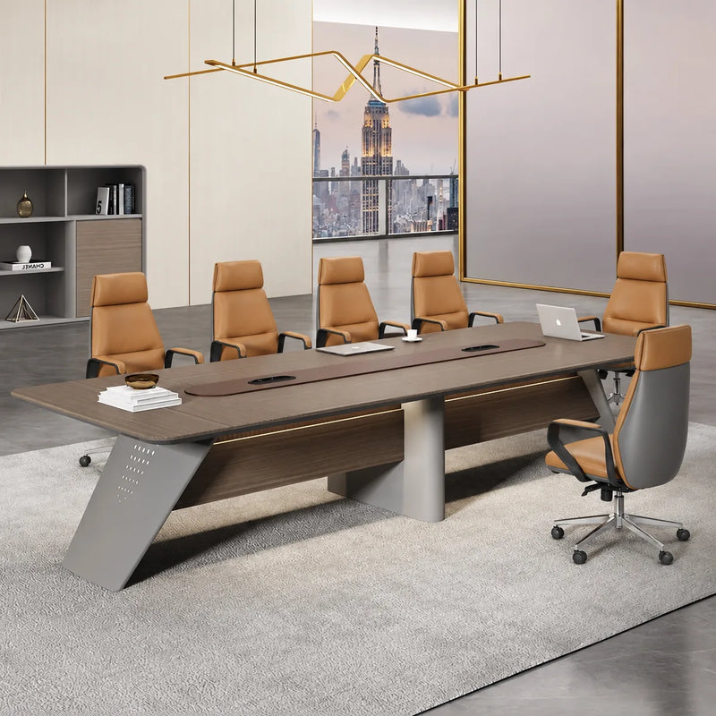 Amity conference table close up, showing the brown center inlay, gray wedge legs and a laptop