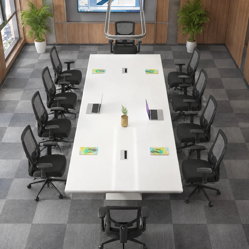 Angled overhead view of the Ardyn white conference table seating 12 in black mesh chairs on checkered carpet