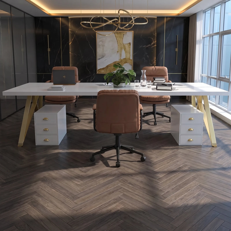Astrid small white meeting table with gold legs beside two white drawer pedestals in a glass-walled office