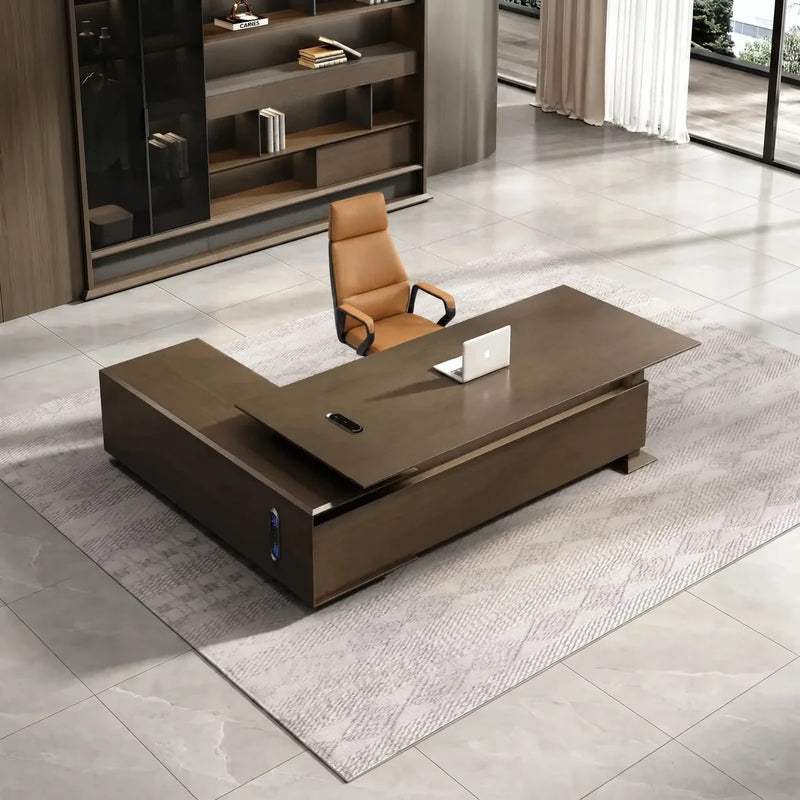 Atlee executive desk with right return and cognac chair in a bright gallery office