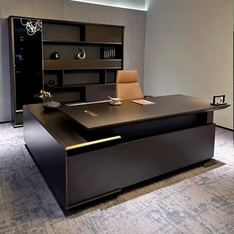 Atlee desk with gold trim reveal and amber chair in a CEO corner office