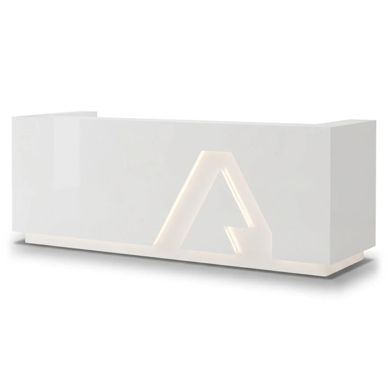 Rillena reception desk with backlit triangle emblem, studio view