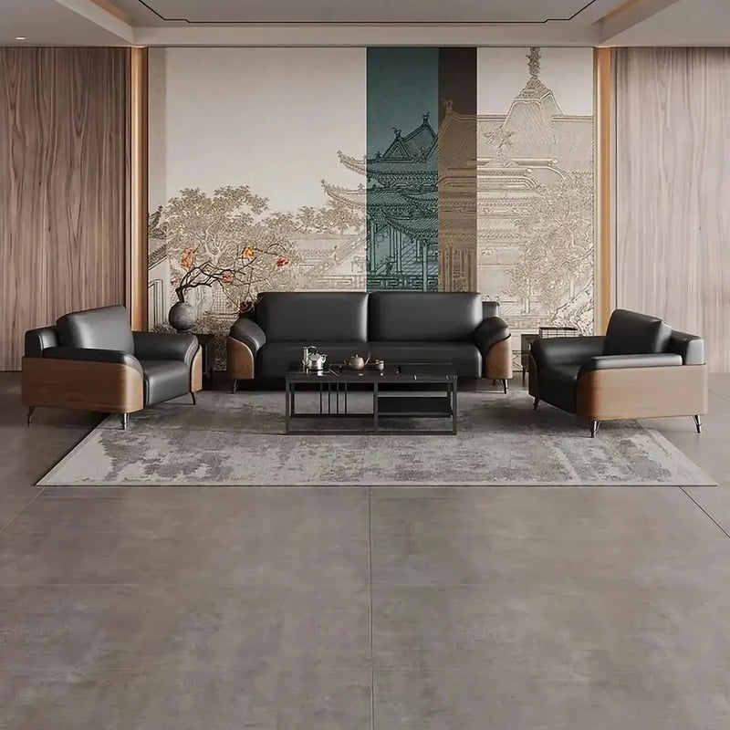 Dalarö black leather conversation set on a rug in a lobby with a pagoda-print mural and wood walls