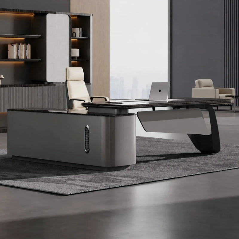 Caldrin desk, right return, in a gray gallery office with cream chair
