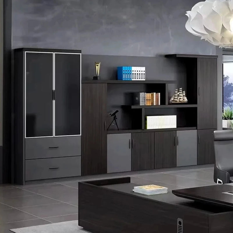 Wexford office wall unit beside an executive desk and chair, dark oak with gray doors and a glass display cabinet