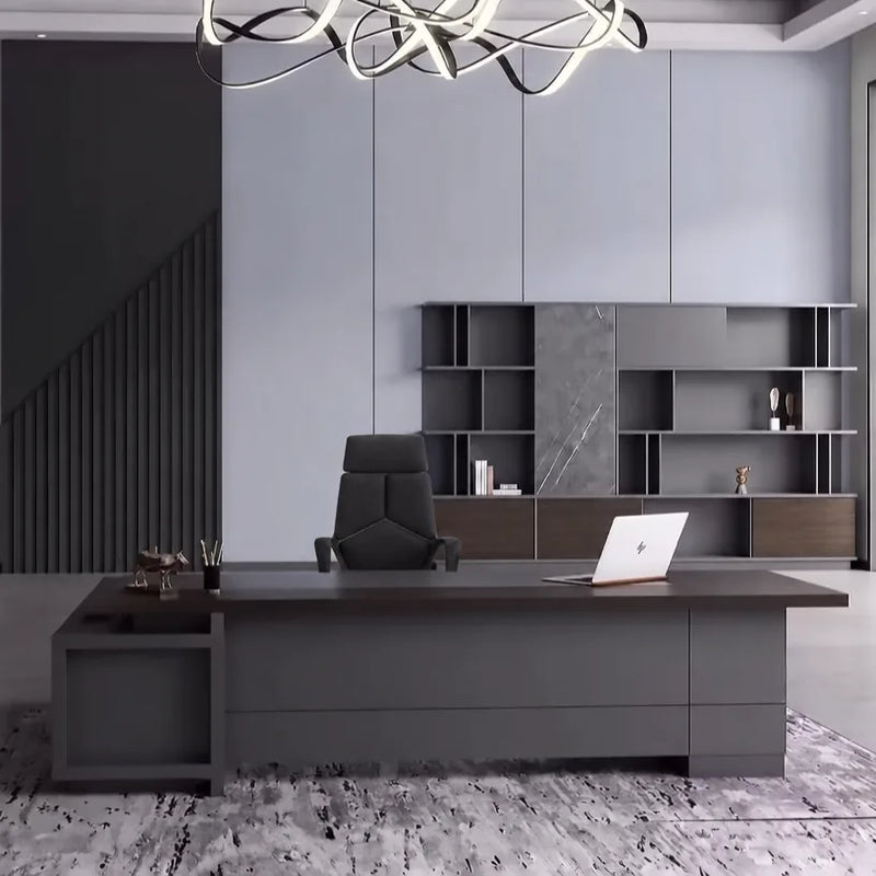 Carwin executive desk beneath a ribbon chandelier, staircase behind
