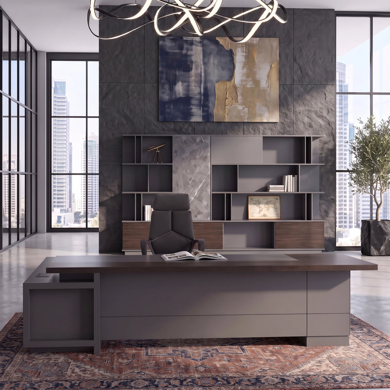 Carwin executive desk beneath a ribbon chandelier, staircase behind