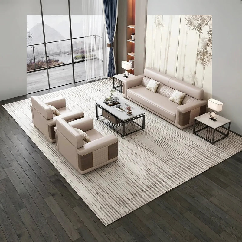Arholma beige leather conversation set with wood-panel arms in a waiting area by a floor-to-ceiling window