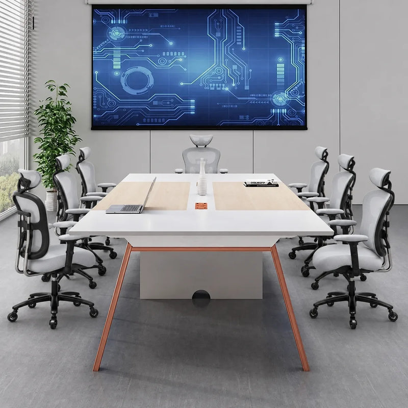 Comity collaborative meeting table seating 8 facing a wall display in a bright conference room