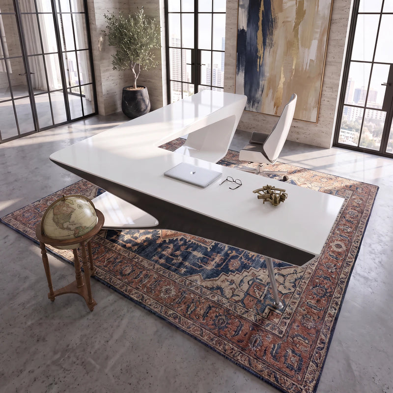 Chevron white L-desk in a sunlit stone tower office with a city view