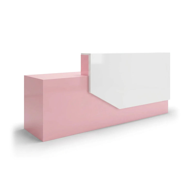 Elira reception desk in rose pink with a white angled front panel, studio view
