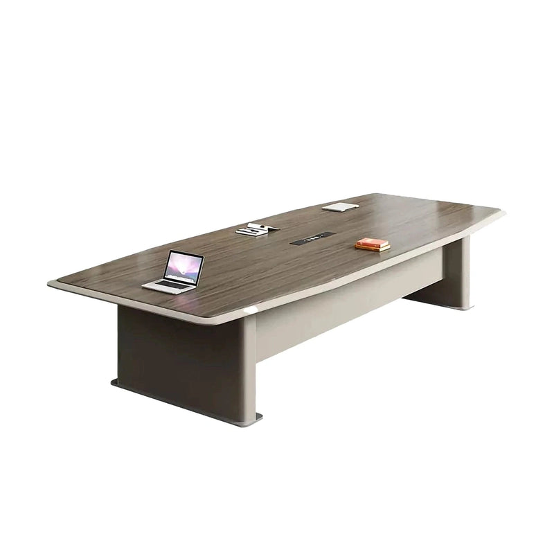 Alwyn walnut meeting table with a laptop, showing the recessed center tray and powered grommets
