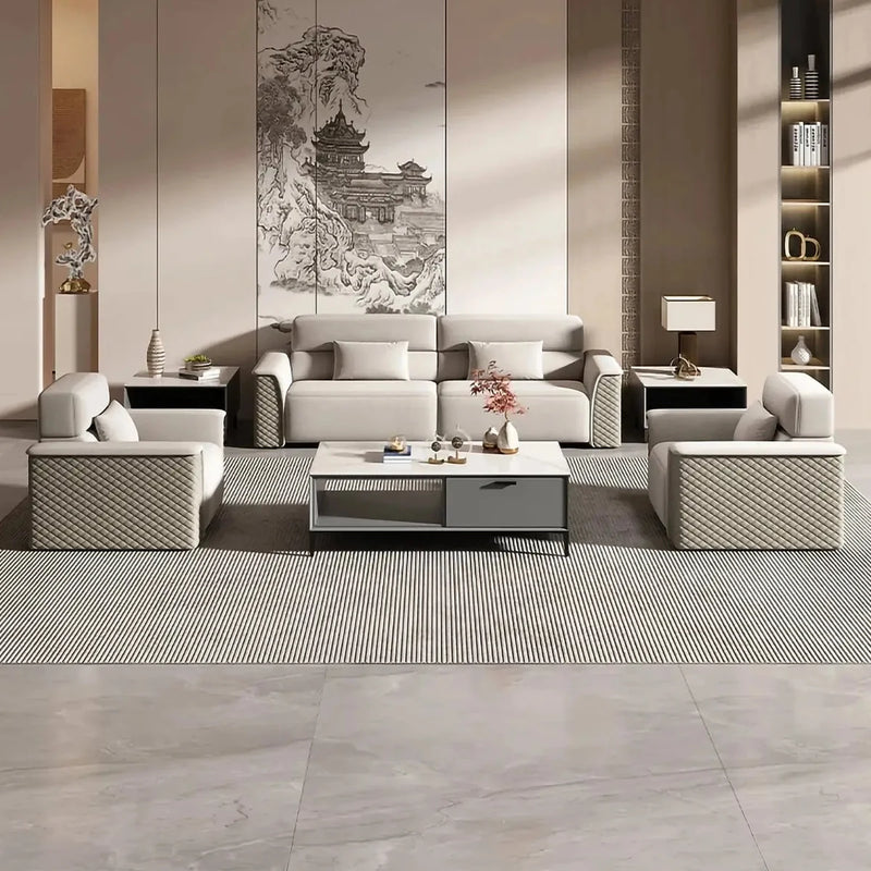 Falun beige leather conversation set in a lounge with a pagoda-print wall panel and striped rug