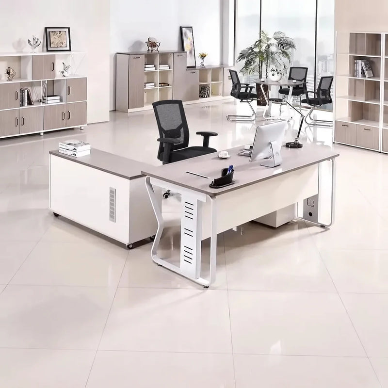 Eszti manager desk with base return in a bright open office