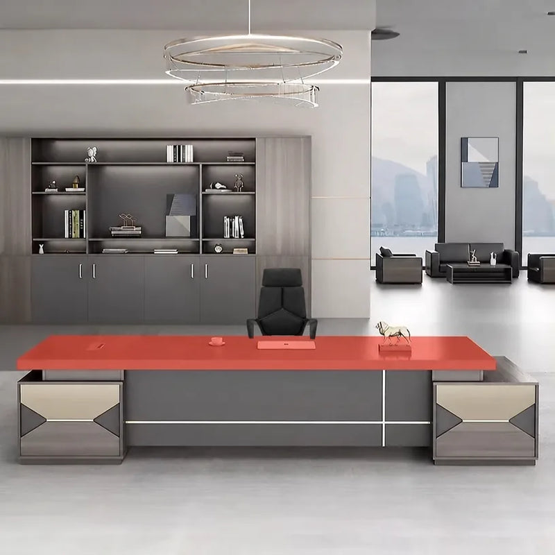 Eyer desk with red desktop over gray base in a showroom