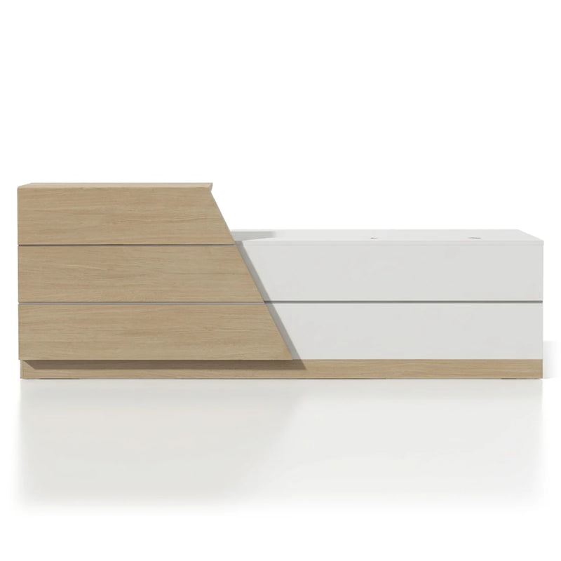 Celandra reception desk in chalk white and light oak, angled studio view