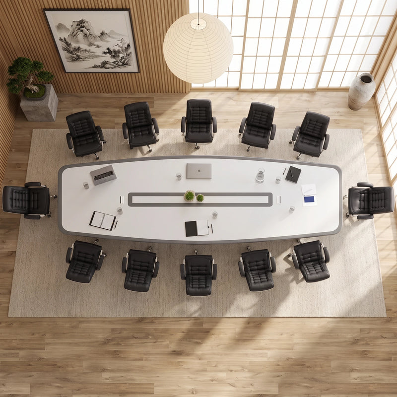 Top-down view of the Harmony white conference table seating 12 in black chairs, center cable channel visible
