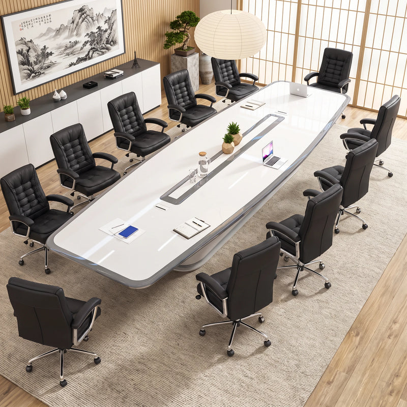 Angled overhead view of the Harmony large conference table with 12 black-and-white chairs and a city night view