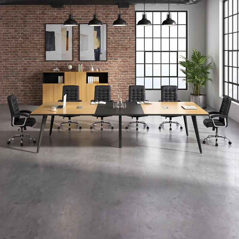 Harvard elm conference room table with black chairs against a concrete wall with city windows