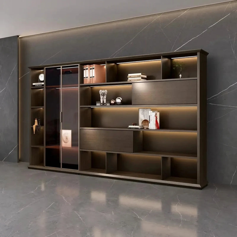 Altus lit office wall unit against a dark marble wall, integrated lighting above each shelf, executive office setting