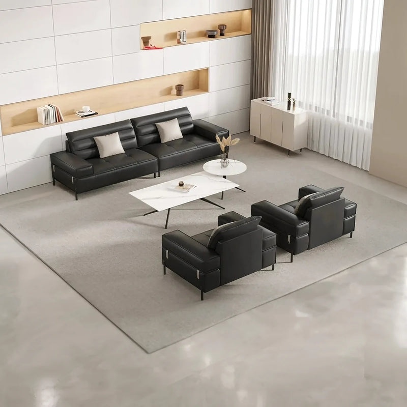 Alnö black leather conversation set arranged around a white coffee table in a bright waiting area