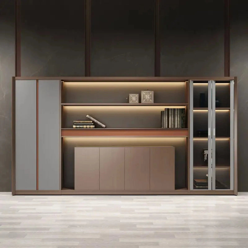 Kelham 13′6″ (162-inch) office shelves in a dark room, integrated lighting on the brown tiers, glass-door display cabinet