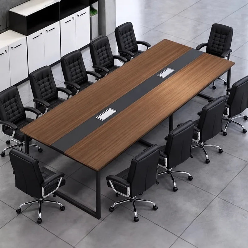 Levan large amber walnut conference table seating 12 in black chairs, angled view with cabinets behind