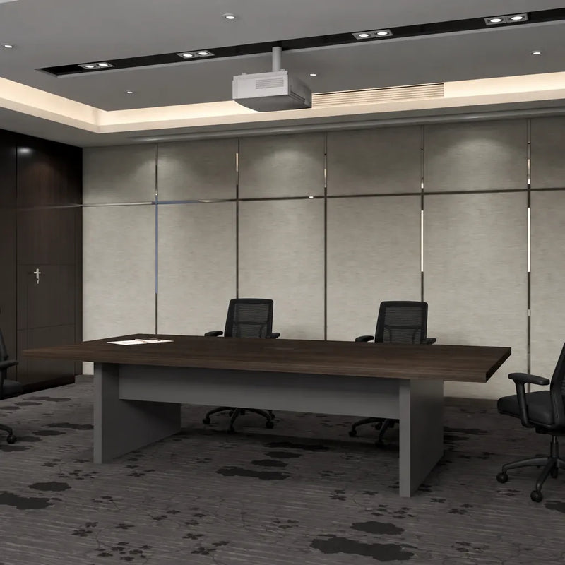 Maxum 8′ or 12′ (96 or 144-inch) meeting table in walnut with two black chairs beneath a projector