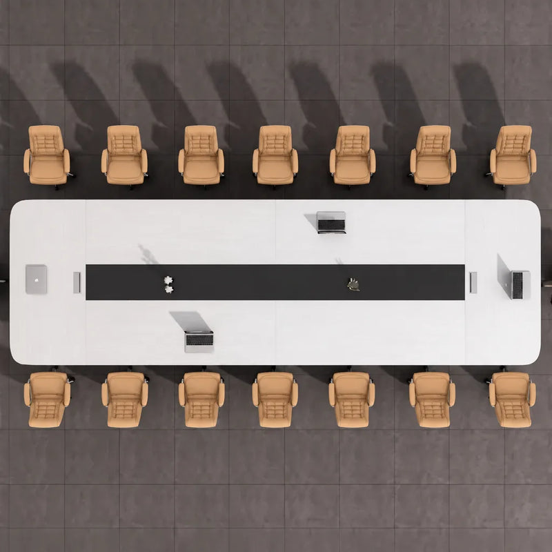 Top-down view of the Nexum grand conference table seating 16 in orange chairs, black cable channel down the center