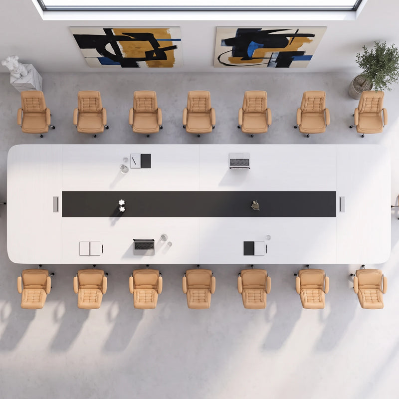 Top-down view of the Nexum grand conference table seating 16 in orange chairs, black cable channel down the center