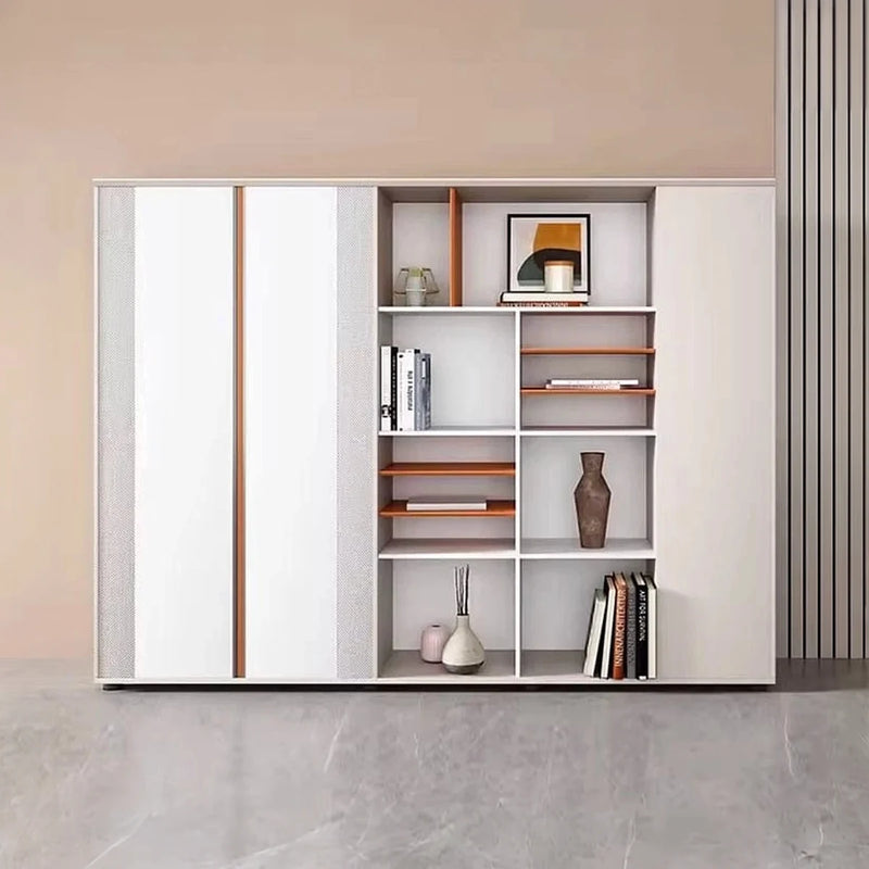 Norbury 7′3″ (87-inch) office wall unit front view in a peach room, books and vases in the white cubbies