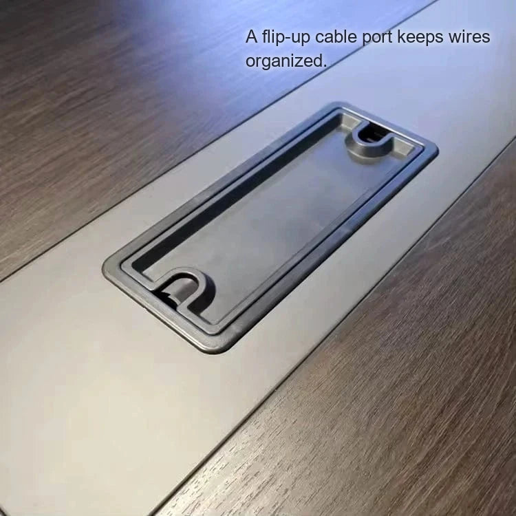 Close-up of a flip-up cable management grommet on the Prime brown tabletop