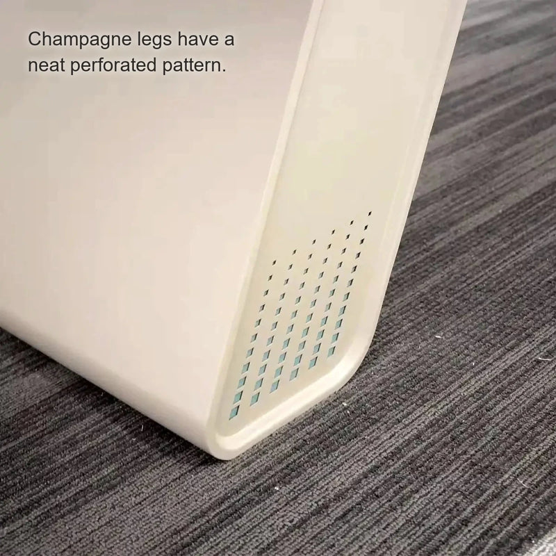 Detail of the Unity champagne leg corner with a perforated pattern on gray carpet
