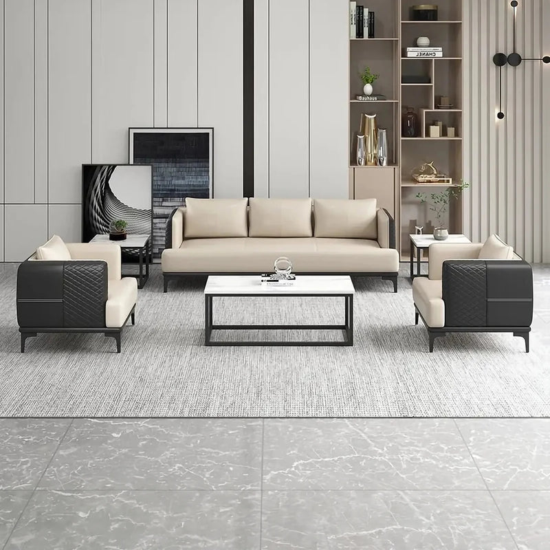 Nässjö black and beige leather lounge set around a white coffee table in a bright room with a display wall
