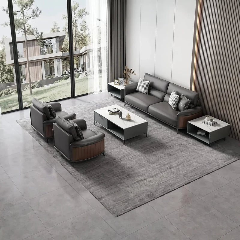 Malmö black leather conversation set on a gray rug beside floor-to-ceiling windows, overhead view