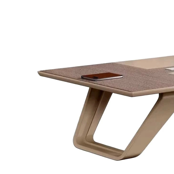 Detail of the Lyric angular beige loop leg beneath the gray oak top