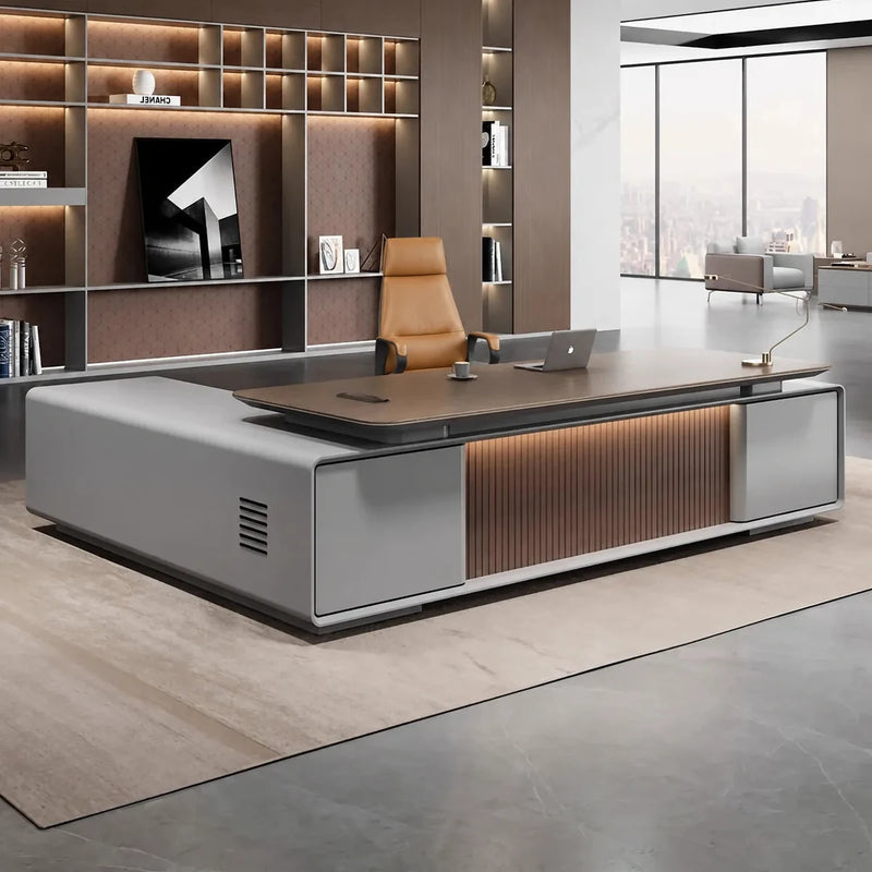 Twilley desk, right return, in a warm CEO office with lit shelving