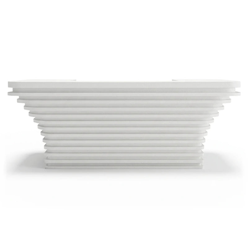 Dahlia reception desk with stepped slab base and recessed counter, studio view