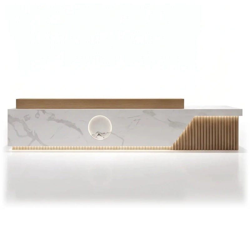 Ovelle marble reception desk, left configuration, in a chandeliered hotel lobby