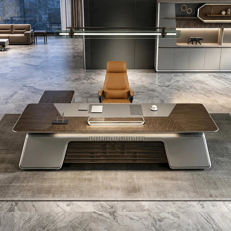 Velluto luxury desk in a marble executive suite with lit shelf wall
